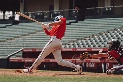 baseball player hitting the ball