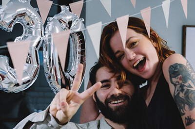 two friends smiling at a birthday