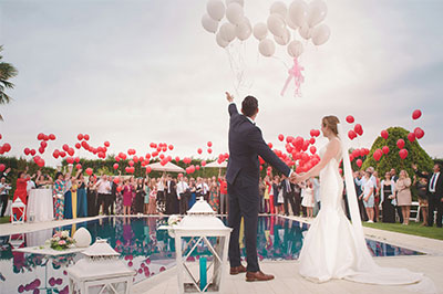 wedding party next to a pool